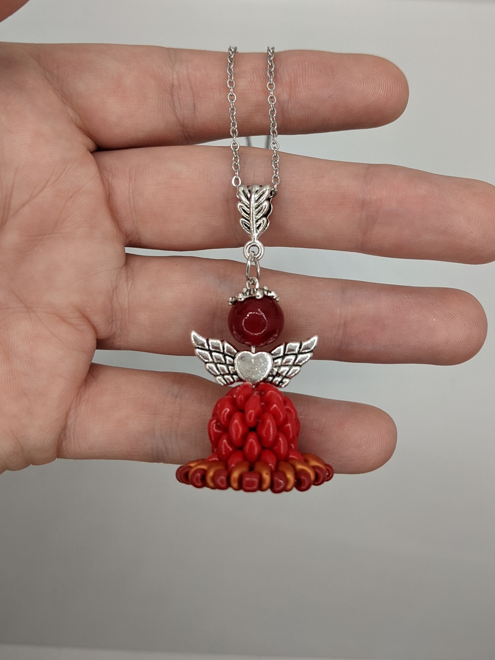 Red Angel Pendant Necklace with Silver-Tone Wings